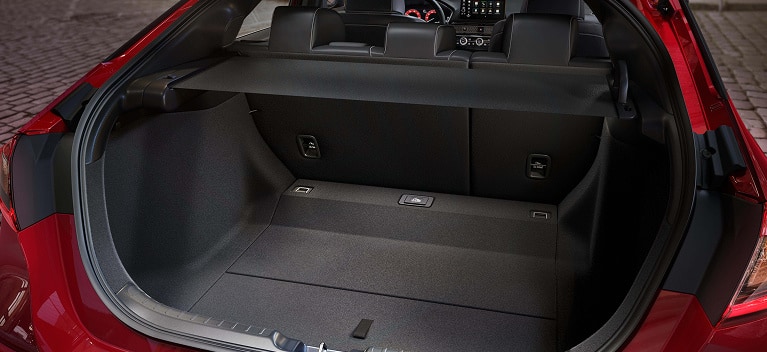 2026 Honda Civic Hatchback Sport Touring Hybrid spacious cargo area with rear seats up and cargo cover (Compact Hatchback).