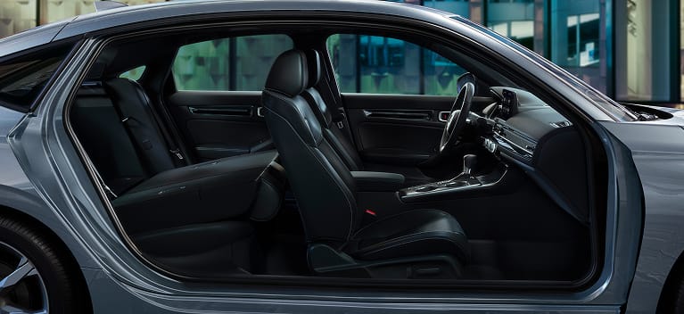 2026 Honda Civic Hatchback Touring Hybrid leather-trimmed seats with rear seat folded down (Compact Hatchback).