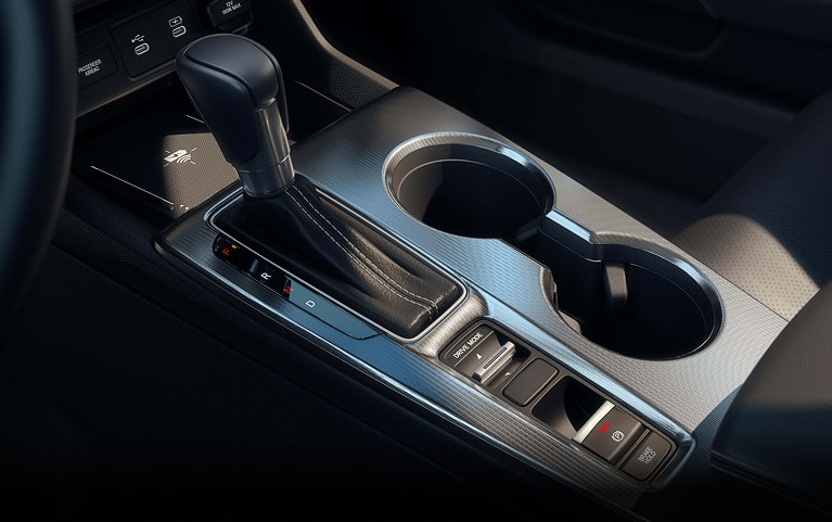  2026 Honda Civic Hatchback center console with gear shift and cup holders (Compact Hatchback).