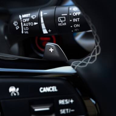 2026 Honda Civic Hatchback Sport Touring Hybrid close up of the steering wheel paddle shifters (Compact Hatchback).