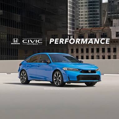 2026 Honda Civic Hatchback Sport Touring Hybrid in Boost Blue Pearl profile on a rooftop parking lot with city buildings (Compact Hatchback).